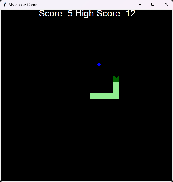 The game at a score of 5 with a high score of 12: a light green snake with a dark green head and a mouth, blue food and the scores at the top